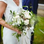Bride holding bouquet of wedding flowers. Photo by Mad Lilies