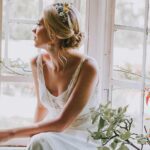 Bride by window. Bridal hair and makeup by Melissa Oldridge. Photo Mindy Coe Photography