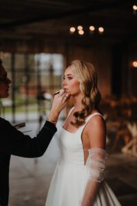 Bride having her makeup touched up