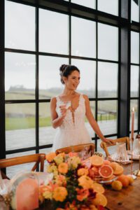 Bride smiling and holding a glass of champagne