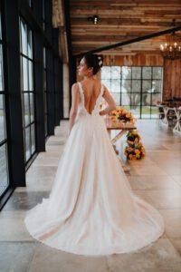 Bride in a backless white wedding dress