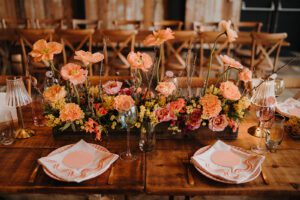 Vibrant coloured wedding flowers on a table